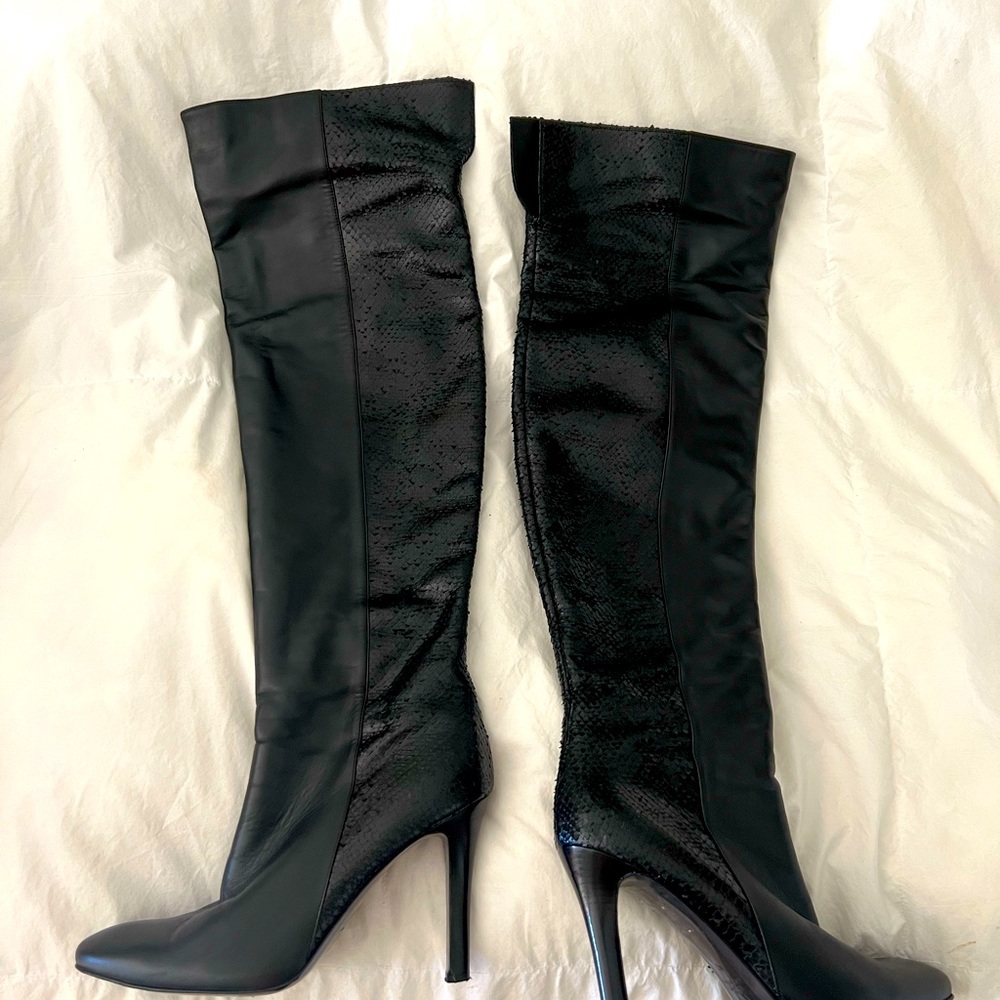 Thigh high black leather boots